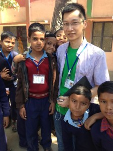 Chris with kids at volunteer placement